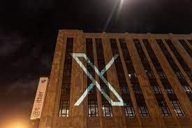 Elon Musk is removing Twitter Bird in favor of “X” x LOGO ON SIDE OF BUILDING